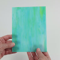 Video of the Teal Lime Opal glass plate in translucent teal, 15x19cm, held up and tilted to show its pattern and transparency