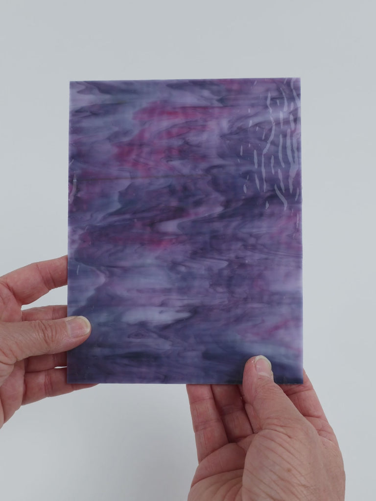 Video of the Lavender Magenta Ripple glass plate in translucent purple, 15x19cm, held up and tilted to show its pattern and transparency