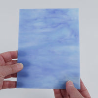 Video of the Current glass plate in translucent blue, 15x19cm, held up and tilted to show its pattern and transparency